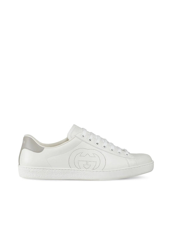 Sneakers with perforated logo