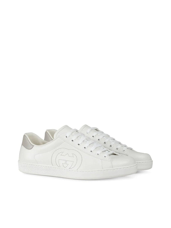 Sneakers with perforated logo