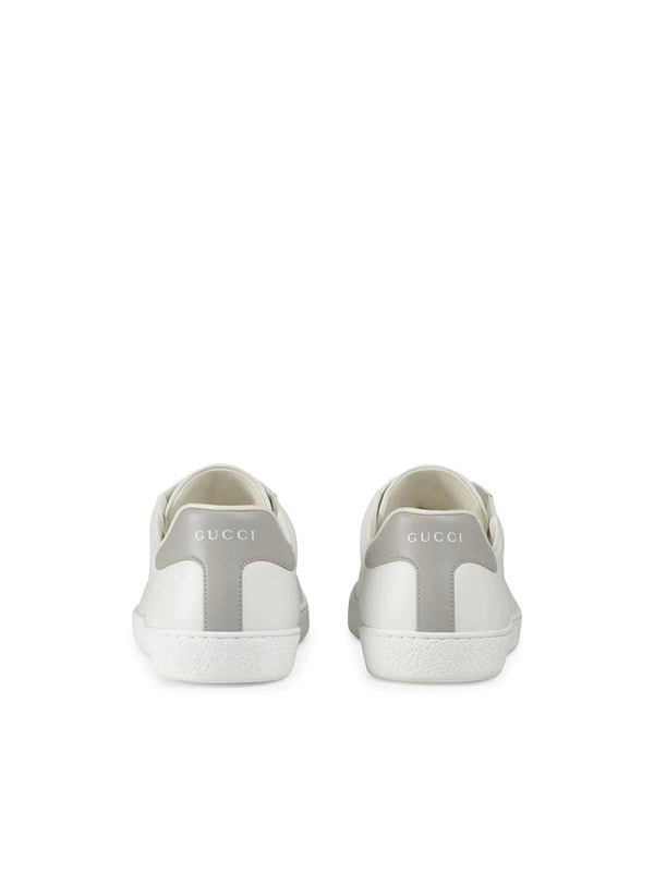 Sneakers with perforated logo