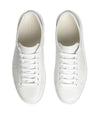 Sneakers with perforated logo