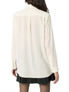 Silk shirt with bow by Gucci.