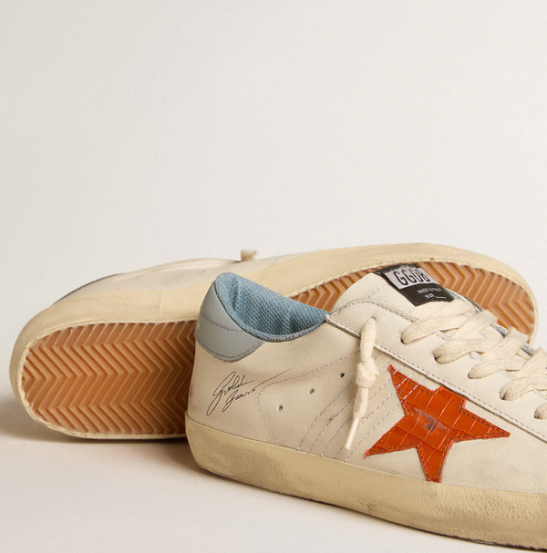 Super-Star Men's with crocodile-print star and silver-blue "LAST PIECES" tag
