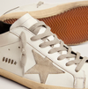 Super-Star with black heel tab and metal studs lettering "LAST PIECES"