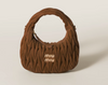 Wander bag in quilted suede