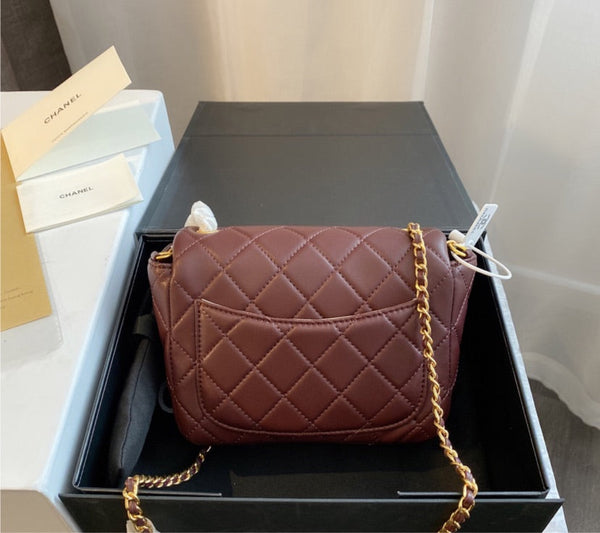 Burgundy Chanel woman handbag