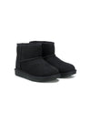 Stivali Classic Mini II per bambina UGG Kids neri con design slip-on